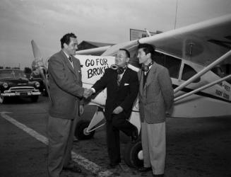 [Henry Ohye and "Go For Broke" airplane, California, February 9, 1951]