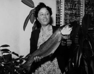 [Mrs. Amagusa and biggest catch in Sunrise Rising Club at Hirohata Insurance Office, Los Angeles, California, May 2, 1951]