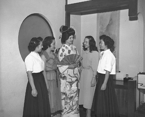 [Caucasian woman wearing a kimono and swimsuit, California, June 19, 1951]