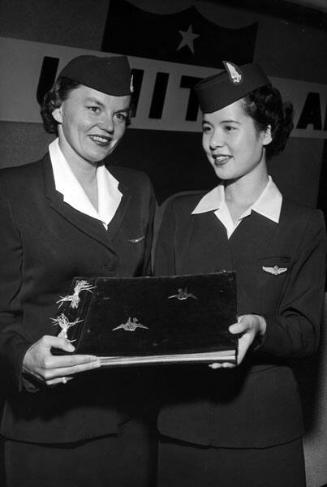 [Two Japanese Airline stewardesses, Califonria, April 21, 1954]