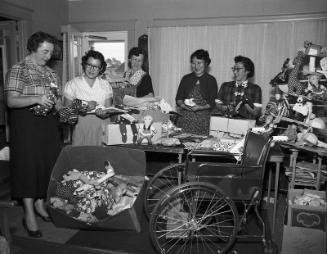 [Parent Teacher Association (PTA) Christmas gift wrapping, California, December 14, 1954]