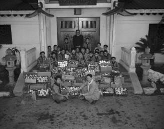 [Boy Scout Troop 379 collecting canned goods for Christmas Cheer drive, Los Angeles, California, December 20, 1954]