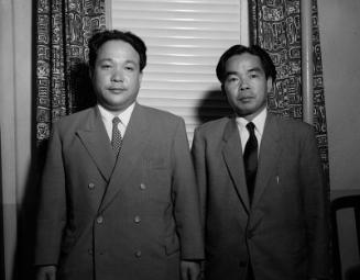 [Masao Ohashi and Shigeru Kinoshita in front of blinds, California, June 19, 1955]