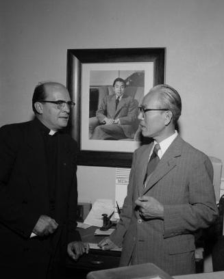 [Father Clement Boesflug and Mr. Tajita at Toyo Miyatake Studio, Los Angeles, California, August 25, 1955]
