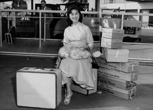[Miss Nisei Week Stella Nakadate arriving from Hawaii at Los Angeles International Airport, Los Angeles, California, September 10, 1955]