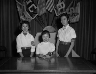 [Three Japanese American girls, student body officers at Virgil Junior High School, Los Angeles, California, February 17, 1956]