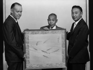 [Eijiro Suematsu and silk painting of trout for President Eisenhower, California, July 18, 1956]