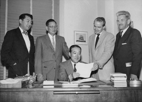 [Consul General of Japan discusses clothing donation to Japan with American Friends Service Committee, Los Angeles, California, November 7, 1956]