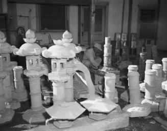 [Yoshio Ota and Japanese stone lanterns, Pasadena, California, December 7, 1956]