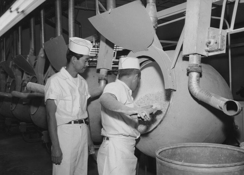 [John Watanabe supervising vitamin coating at Boyle & Company, Los Angeles, California, December 10, 1956]