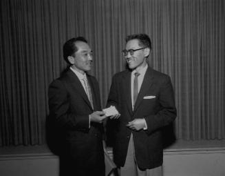 [Jockey George Taniguchi receives honorary Southwest Japanese American Citizens' League chapter membership at Centenary Methodist Church, Los Angeles, California, March 6, 1957]
