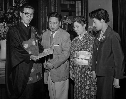 [Japanese actor Kazuo Hasegawa and wife at airport, Los Angeles, California, April 11, 1957]