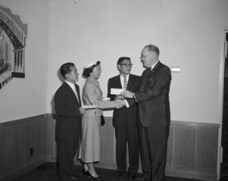 [Three Nisei seniors receiving Bank of America Achievement awards at Statler Hotel, Los Angeles, California, May 9, 1957]