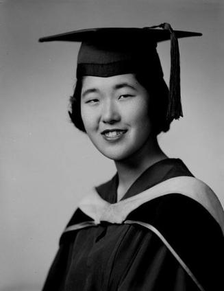 [Yoshiko Nakahiro in cap, gown and hood, head and shoulder portrait, Los Angeles, California, June 11, 1957]