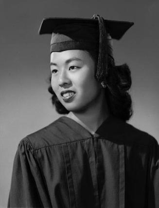 [Irene Wakamatsu in cap and gown, half-portrait, Los Angeles, California, June 12, 1957]