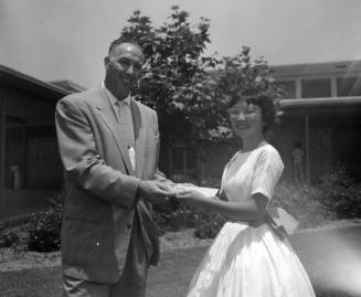[Pacoima Junior High School student, Zen Takahashi, receiving American Legion award, Pacoima, California, June 20, 1957]
