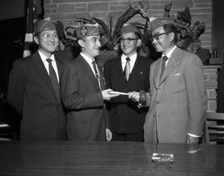 [Installation of Veterans of Foreign Wars Nisei Memorial Post 9938 commander and Auxiliary president at Swally's restaurant, Los Angeles, California, May 28, 1955]