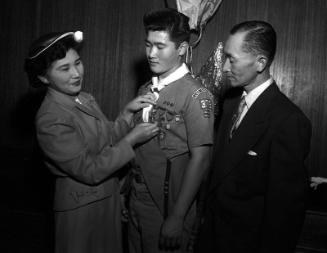 [Two boy scouts of Troop 379 receiving Eagle Scout rank, Los Angeles, California, July 8, 1955]