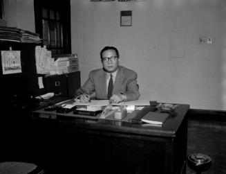 [Toho Nakashima seated at desk, California, November 28, 1955]