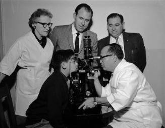 [All Nations Clinic receiving new eye exam equipment from the City Terminal Lions Club of Los Angeles, Los Angeles, California, January 10, 1958]