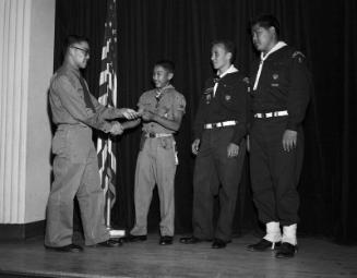 [Boys scouts of Troop 9 receiving Eagle Scout award at St. Mary's Episcopal Church, Los Angeles, California, June 13, 1958]