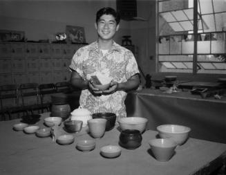 [Young man with first place bowl at Belmont High School ceramic exhibition, Los Angeles, California, June 17, 1958]