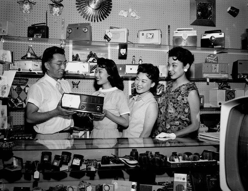 [Eiji Tanabe of Far East Travel Service and Roy Hiroto of Ginza Gift Center promoting the Nisei Legal Secretaries Association and Premieres club "Trick or Treat ball", Los Angeles, California, July 26, 1958]