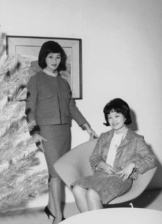 [Designer Iris Teragawa with fashion model, California, December 7, 1961]