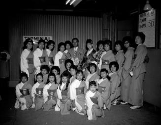 [Chiyonosuke Azuma with Banto Misa group at Los Angeles International Airport, Los Angeles, California, January 14, 1962]