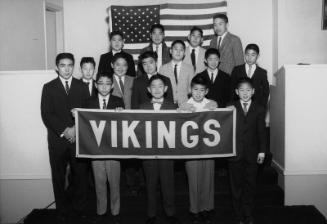 [Vikings Gra-Y Club receiving American flag flown over United States Capitol at Centenary Methodist Church, Los Angeles, California, February 6, 1962]