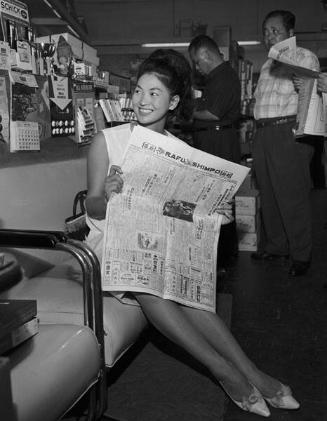 [Noriko Ando, Miss Universe contestant of Japan, visits L.A. Sporting Goods, Los Angeles, California, August 3, 1963]