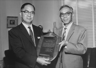 [Narufumi Yano of Japan Traders' Club of Los Angeles receiving plaque in Consul General of Japan's office, Los Angeles, California, September 1963]