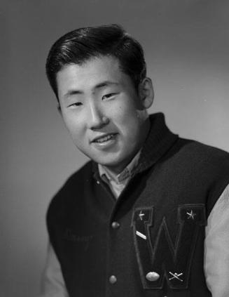 [Danny Hirata in letterman jacket, head and shoulder portrait, Los Angeles, California, December 14, 1963]