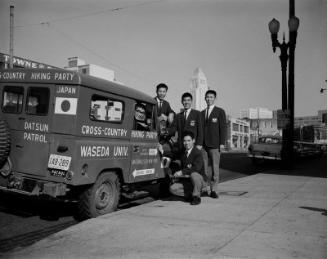 [Waseda University students from Japan and jeep, Los Angeles, California, January 14, 1964]