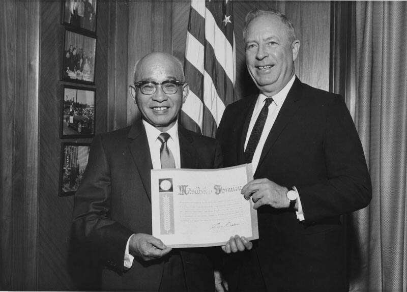 [Citation presentation to Mitsuhiko Shimizu of Asahi Shoes and Dry Goods by Supervisor Ernest Debs in his office, Los Angeles, California, February 26, 1964]