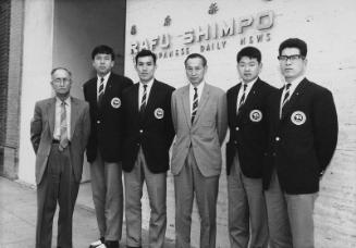 [Mikio Oda with track and field athletes from Japan in front of Rafu Shimpo office, Los Angeles, California, March 16, 1964]