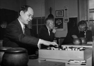 [Mr. Iino playing Go at Gokaisho, Los Angeles, California, December 4, 1964]
