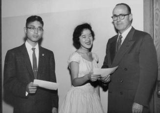 [Two students receiving awards at Maryknoll School, Los Angeles, California, ca. 1950-1964]
