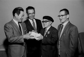 [Four men and gift box, California, ca. 1950-1964]