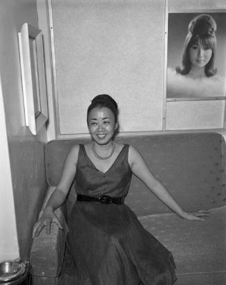 [Yurijo Amemiya on couch at Toyo Miyatake Studio, Los Angeles, California, April 1965]