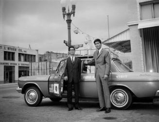 [Takeuchi brothers with Tokyo USA Friendship automobile, Los Angeles, California, September 16, 1965]
