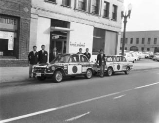 [U.S. - Japan Goodwill Sister City Mission automobiles in front of Rafu Shimpo, Los Angeles, California, January 1, 1966]