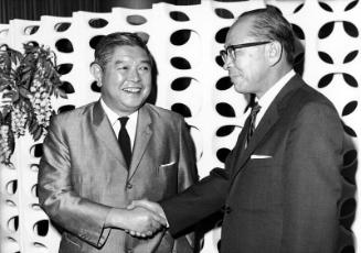 [Shintaro Fukushima shaking hands with Toshiro Shimanouchi, Consul General of Japan, Los Angeles, California, September 1966]