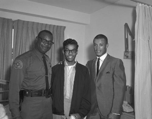 [Young African American man holding baseball, California, 1966?]