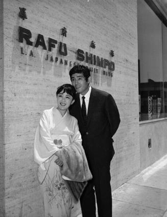 [Japanese movie actors, Tatsuya Nakadai and Kiyoko Miyazaki, in front of Rafu Shimpo, Los Angeles, California, June 2, 1967]