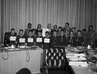 [Los Angeles Supervisor Ernest E. Debs presenting "Friendship Day" proclamation to Boy Scouts, Los Angeles, California, July 27, 1967]