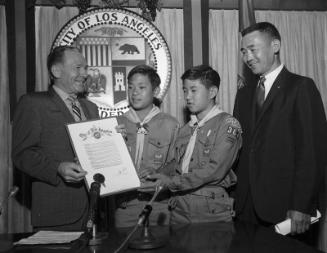 [Los Angeles Mayor Sam Yorty presenting proclamation to Boy Scouts at Los Angeles City Hall, Los Angeles, California, August 2, 1967]