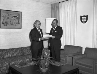 [Henry Ohye presents a citation to Consul General Toshiro Shimanouchi at the office of Consul General of Japan, Los Angeles, California, July 11, 1968]