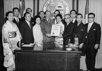 [Los Angeles Mayor Sam Yorty presenting proclamation to Osamu Shimizu at Los Angeles City Hall, Los Angeles, California, October 9, 1968]