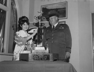 [Mari Hattori, Queen of Henry Oiye Trophy Race, with trophy, California, May 31, 1968]